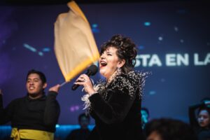 woman in black long sleeve shirt holding microphone